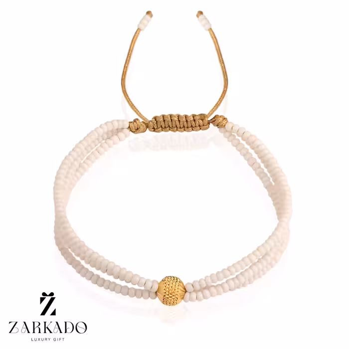 دستبند میوکی سفید سه رج و گوی طلا چکشی