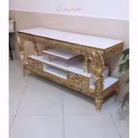میز تلویزیون دو کشو، طرح طاووسی، جنس آلیاژ آلومینیوم، آبکاری برنز