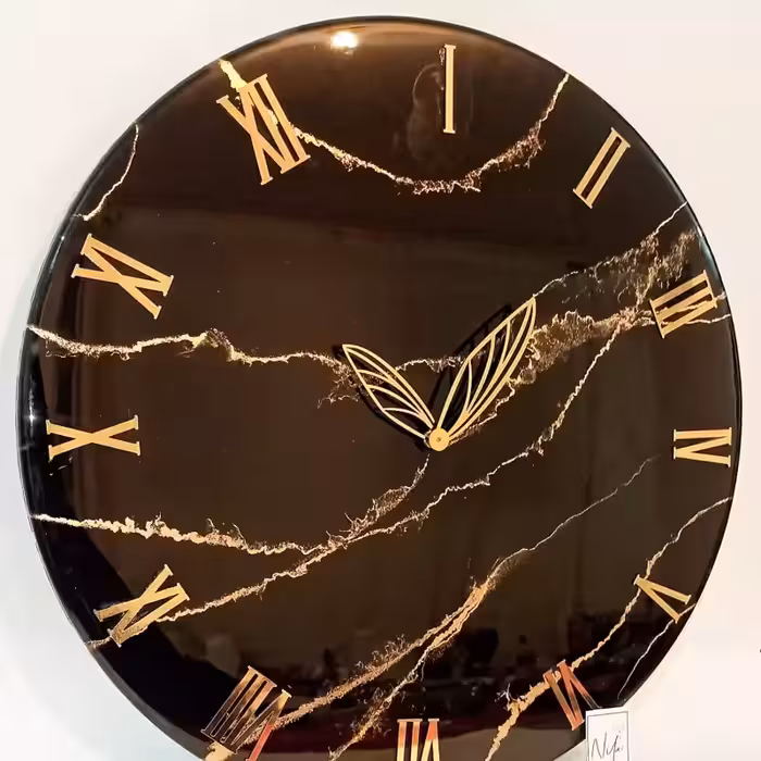 ساعت دیواری مشکی طلایی طرح سنگ  رزینی قطر60
