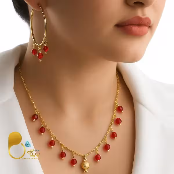 گردنبند و گوشواره خوشه کریستالی با آویز انار طلایی