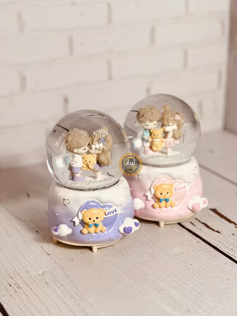 گوی موزیکال پمپی چراغدار بزرگ طرح دختر پسر با عروسک خرسی کد 6572