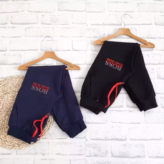 شلوار اسلش دخترانه و پسرانه رنگ سورمه ای و مشکی سایز 80 و 85 طرح BOSS کد688n