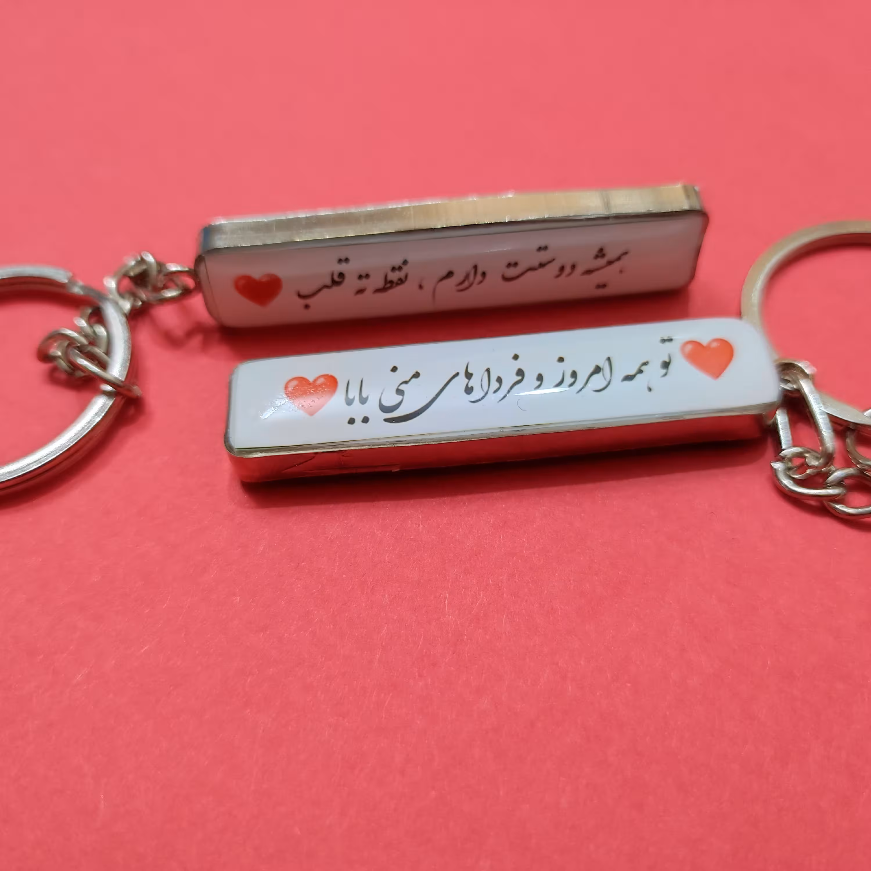 سر کلیدی رزینی پلاک ماشین با قاب استیل رنگ نقره ای  