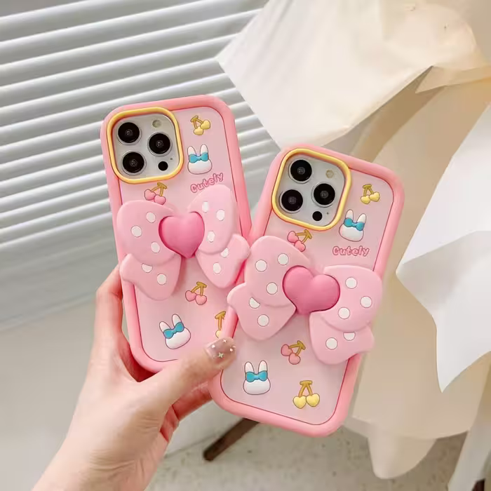 قاب فانتزی طرح cutely ribbon استند دار ایفون 14promaxCutely ribbon design fantasy case with stand for iPhone 14promax