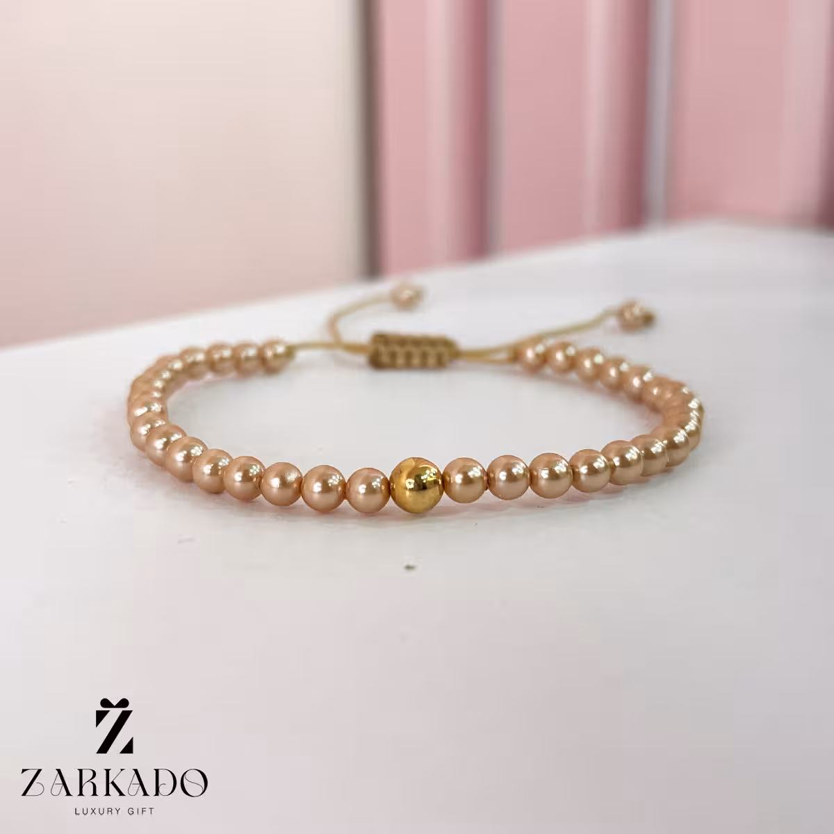 دستبند مرواریدی رزگلد با گوی طلا کد B2892