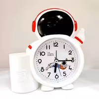 ساعت رومیزی فضانورد زنگدار ( زنگ دار ) ساعت فانتزی دکوری ( خرید عمده دکوری و فانتزی و لوازم تحریر بندر گناوه )