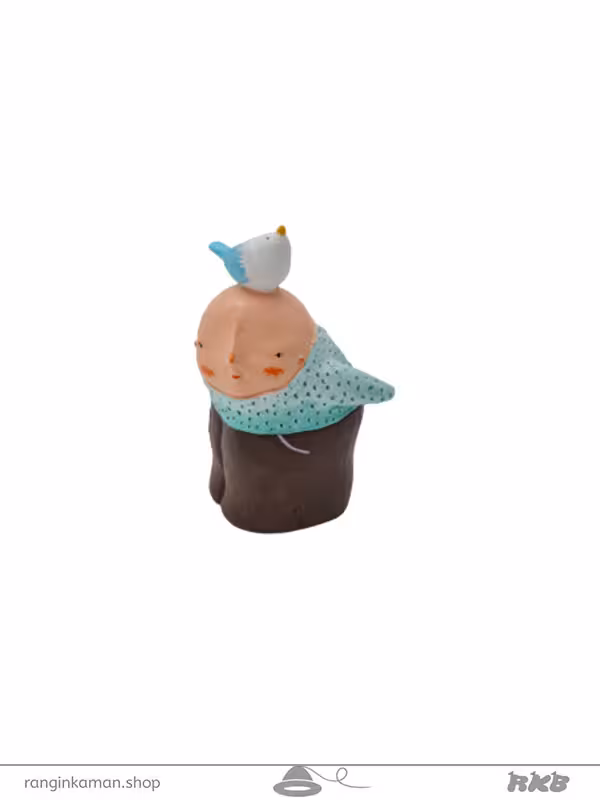 مجسمه پسربچه و پرنده