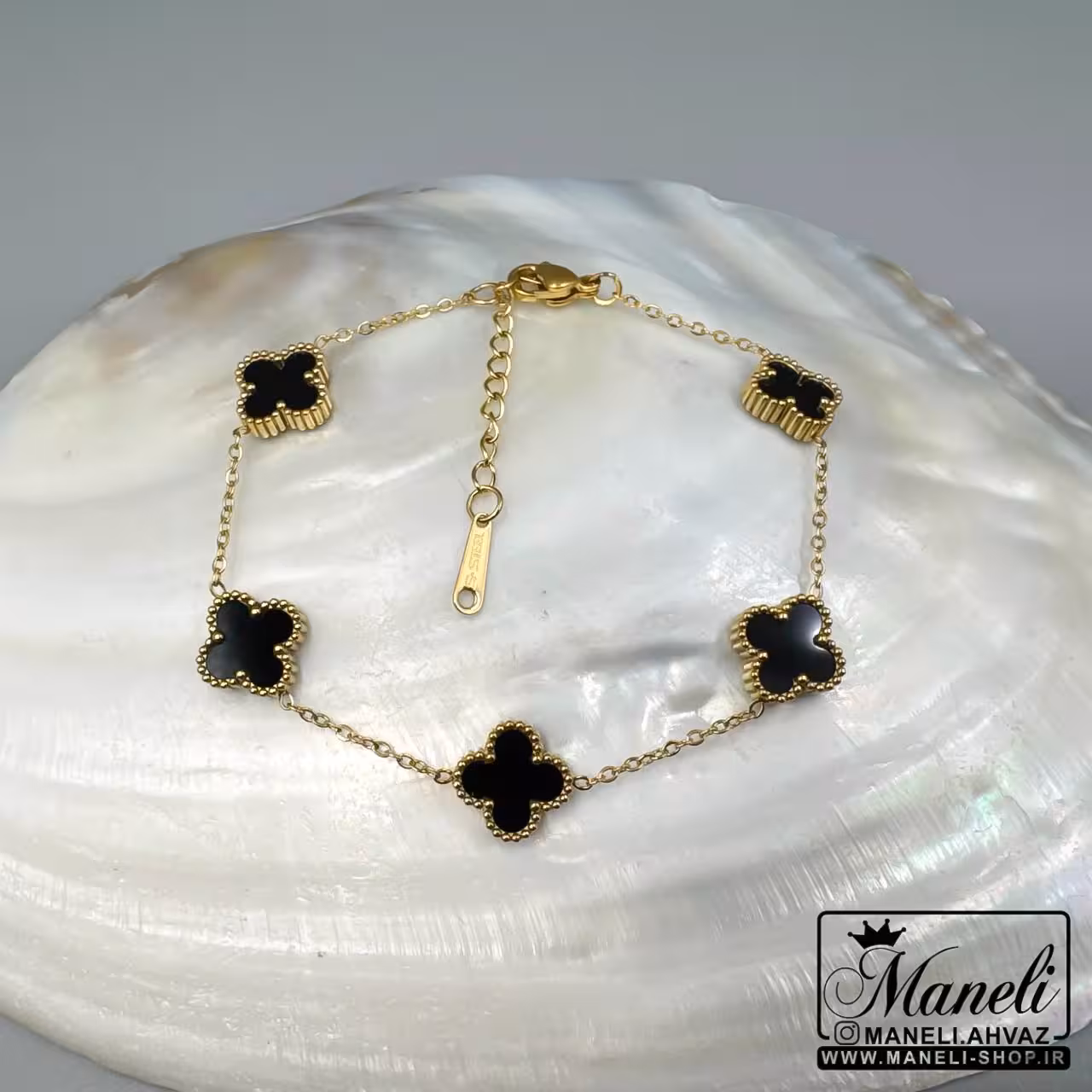 دستبند ونکلیف طلایی با گل مشکی|14040451