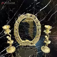 آینه و شمعدان برنزی بیضی شکل در طرح گل شقایق و طلایی رنگ بسیار خاص و شیک