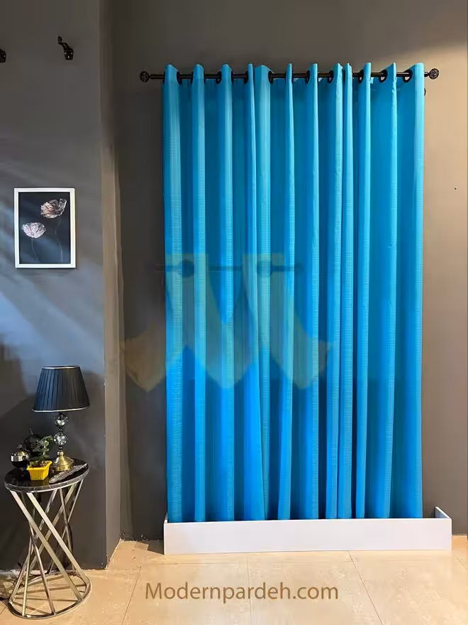 پرده آماده پانچی حریر بافتدار رنگ فیروزه‌ای عرض 1/5 تا 2 متر