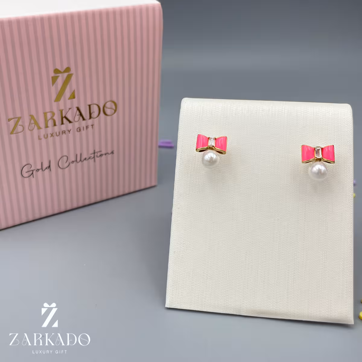 گوشواره میخی طلا طرح پاپیون صورتی و مروارید کد E22