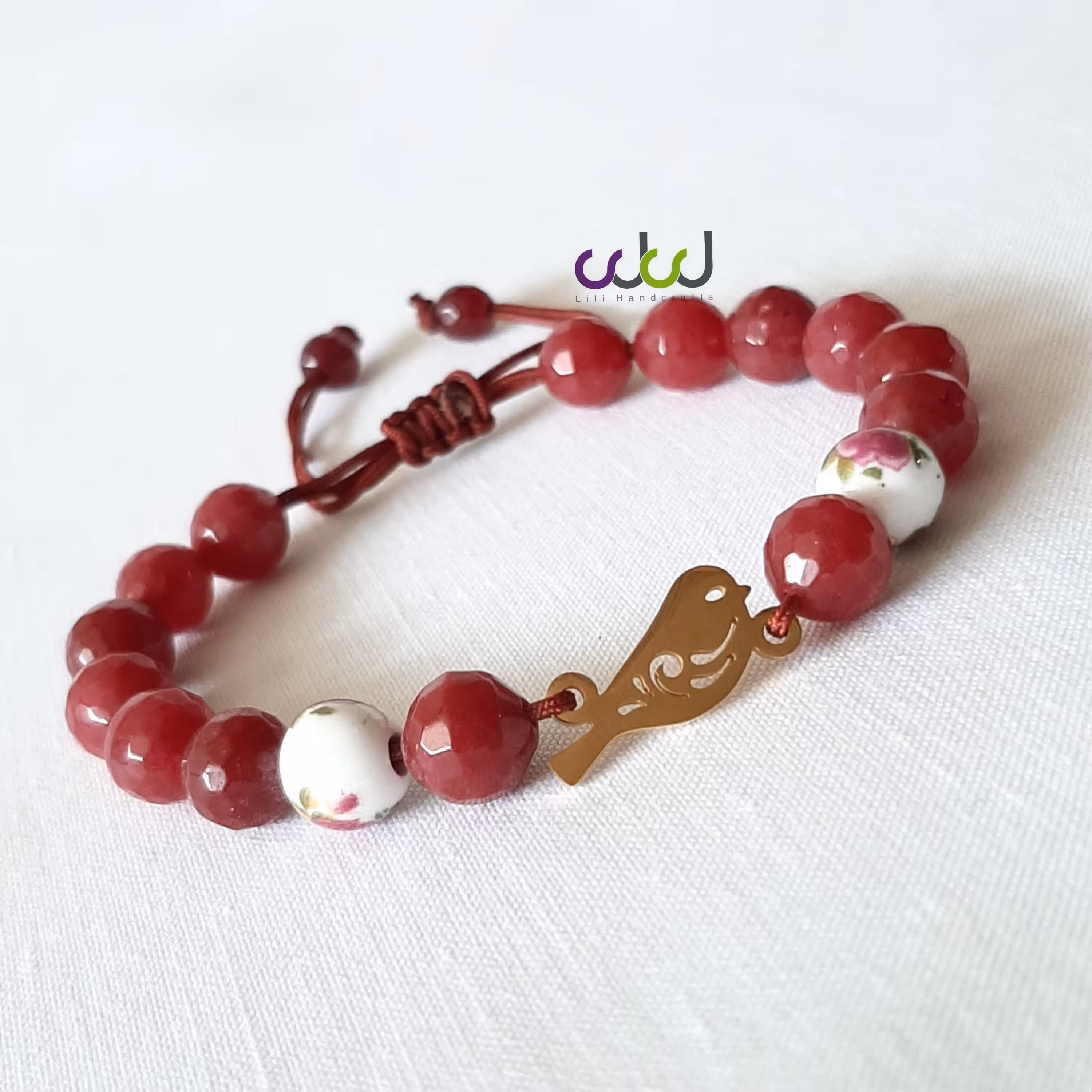 دستبند سنگ عقیق و پلاک استیل پرنده 