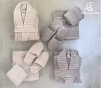 سرویس حوله عروس و داماد مدل دالورا کرم طوسی‌