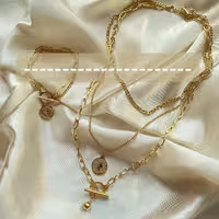 گردنبند دستبند سه ردیفه کارتیر ریز و متوسطو زنجیر بیضی شکل