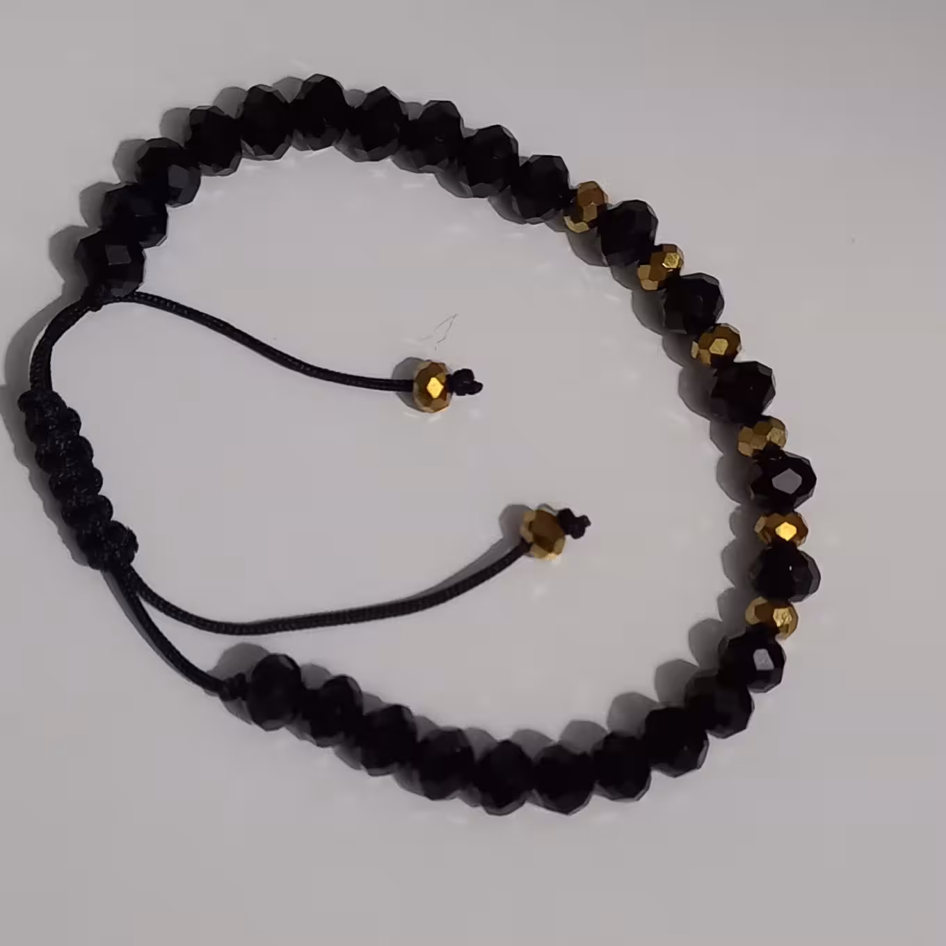 دستبند کریستالی مشکی طلایی  بند کشویی