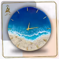 گالری آماندا ساعت دیواری رزینی قطر 40 طرح دریا شنی با قابلیت تغییر رنگ