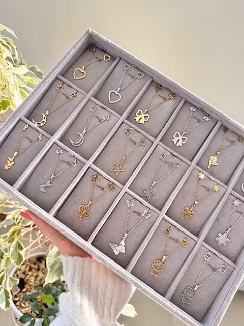 نیمست زنانه  استیل 99تومنی شامل گردنبند و گوشواره طرحای متنوع رنگ طلایی و نقره ای رنگ ثابت