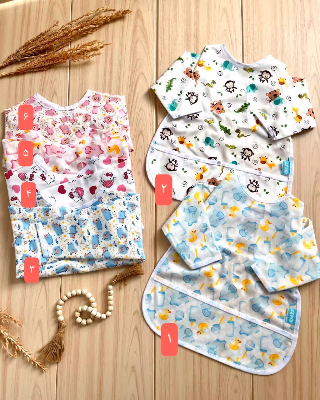 لوازم سیسمونی پیشبند آستین دار بچهگانه