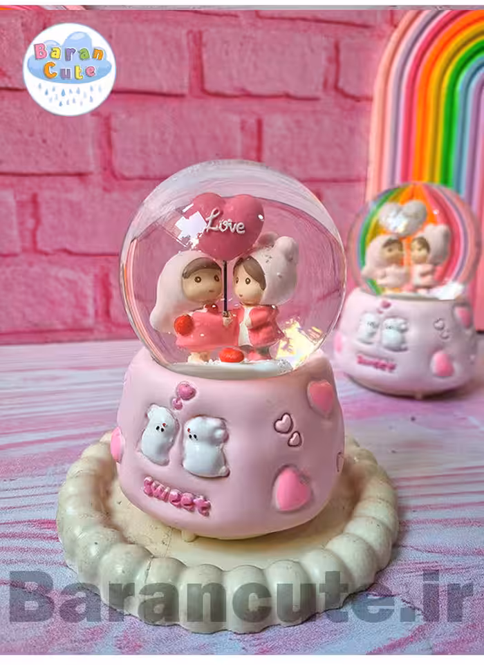 گوی موزیکال برفی چراغ دار (سایز متوسط) طرح عاشقانه صورتی