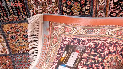 فرش ماشینی زمرد مشهد طرح خشتی مدل ترنج زمینه آبی