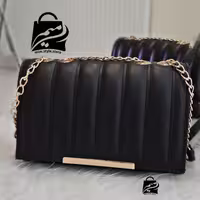 کیف آیناز مشکی .  چرم صنعتی با کیفیت . بند ترکیبی زنجیری و چرمی
