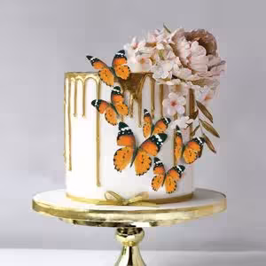 پروانه کیک نارنجی مشکی تزیینی غیر خوراکی