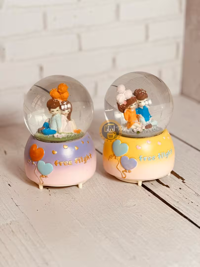 گوی موزیکال پمپی چراغدار بزرگ طرح دختر پسر نشسته کد 6554