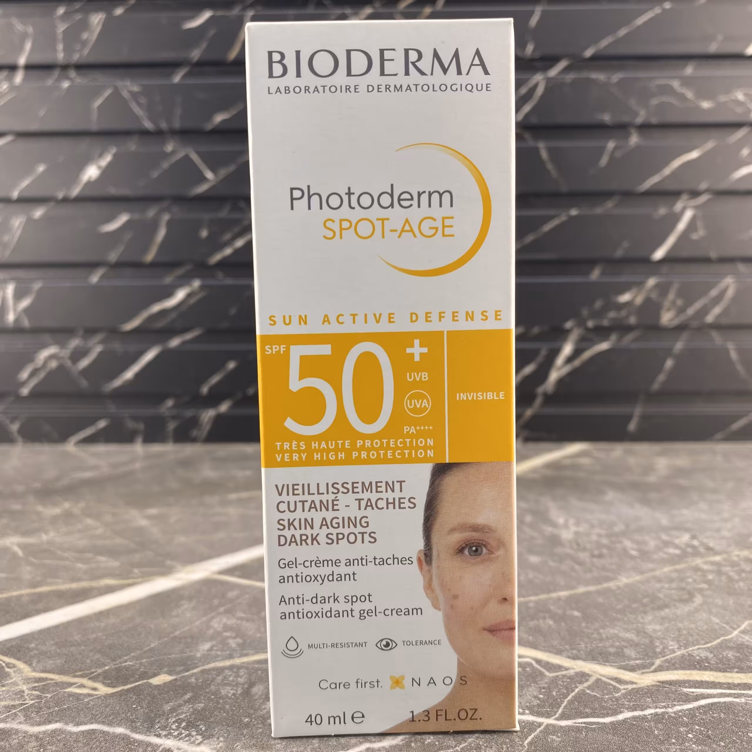 ژل کرم ضد آفتاب ضد لک و ضد پیری بایودرما  SPF50 مدل Photoderm Spot-Age بی رنگ 40 میل