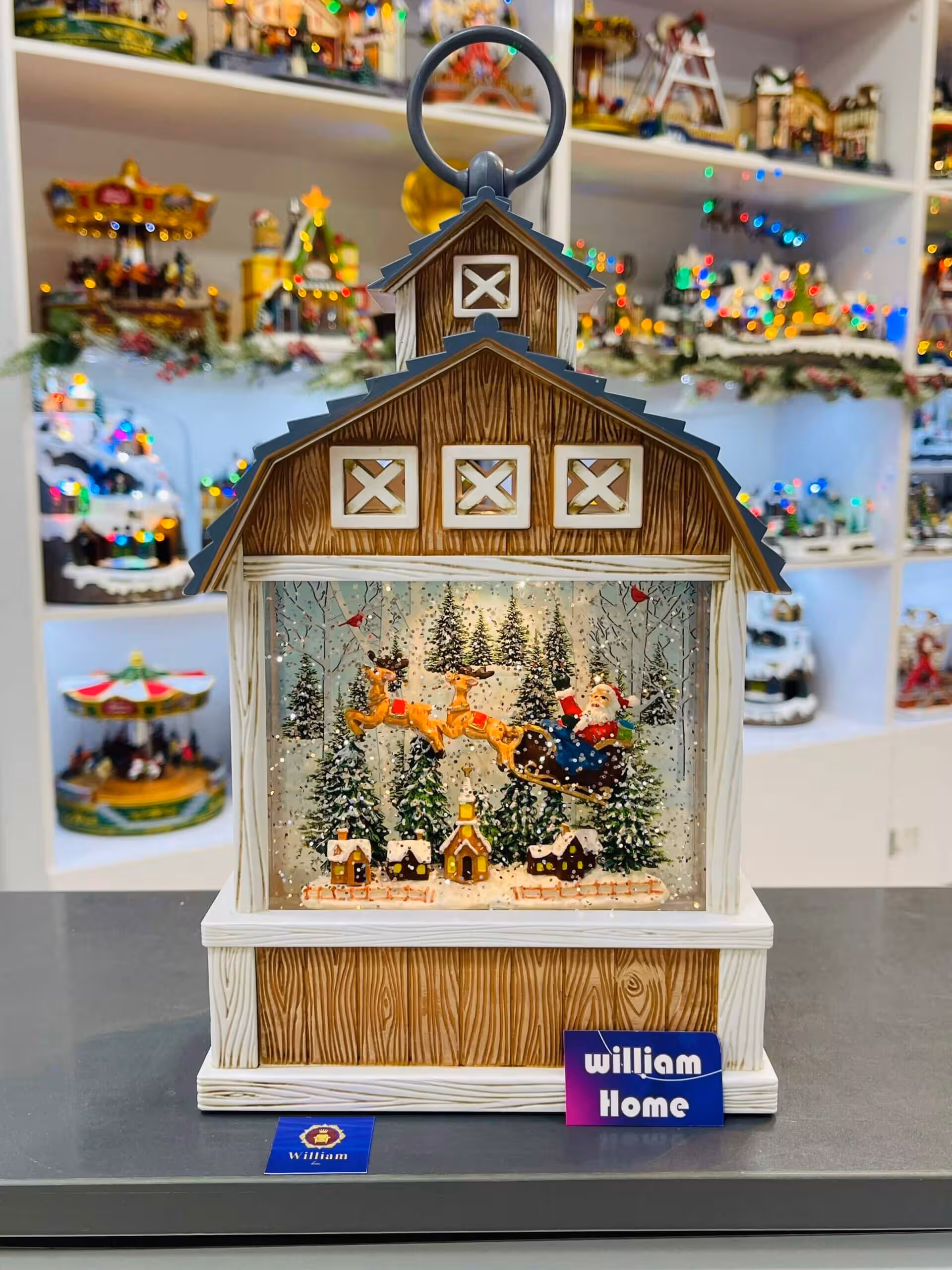 فانوس موزیکال کلبه ای بابانوئل سورتمه سوار و گوزن شمالی