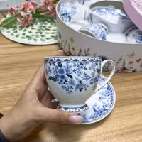 ست چایخوری 12 پارچه گل‌دار کد 6106 | فنجان و نعلبکی چینی طرح گل‌های آبی
