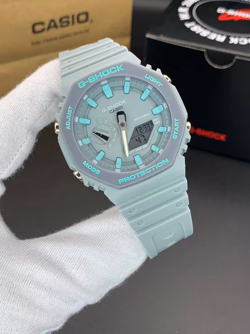 ساعت مچی کاسیو جیشاک مدل GA-2100 صفحه طوسی فیروزه ای بند آبی