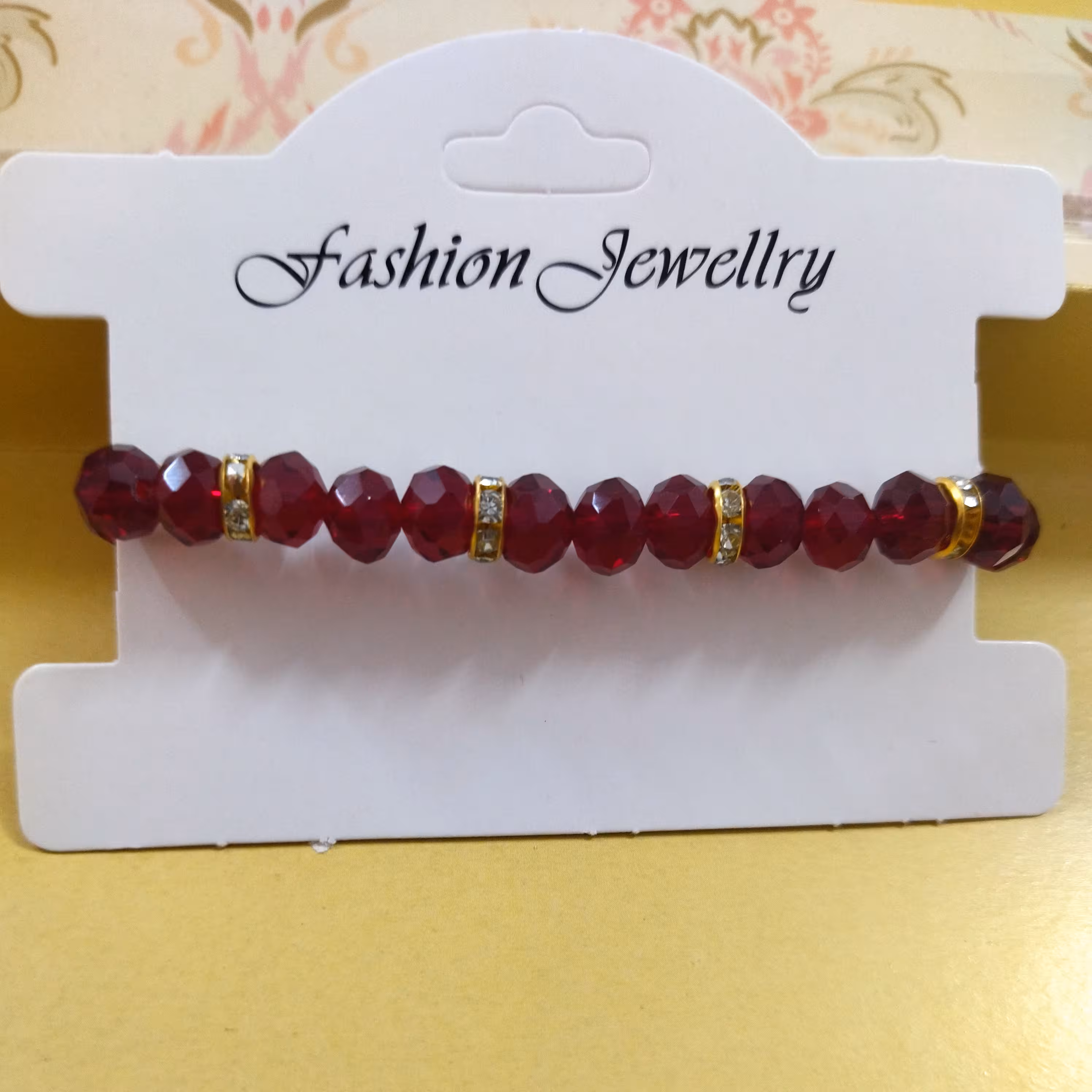 دستبند کریستال زرشکی 