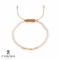 دستبند مروارید سفید و طلا گوی البرنادو فاصله دار