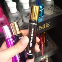 عطر جیبی مردانه پاشا رایحه کاپیتان بلک حجم 22 میل (دارای رایحه تند و گرم)