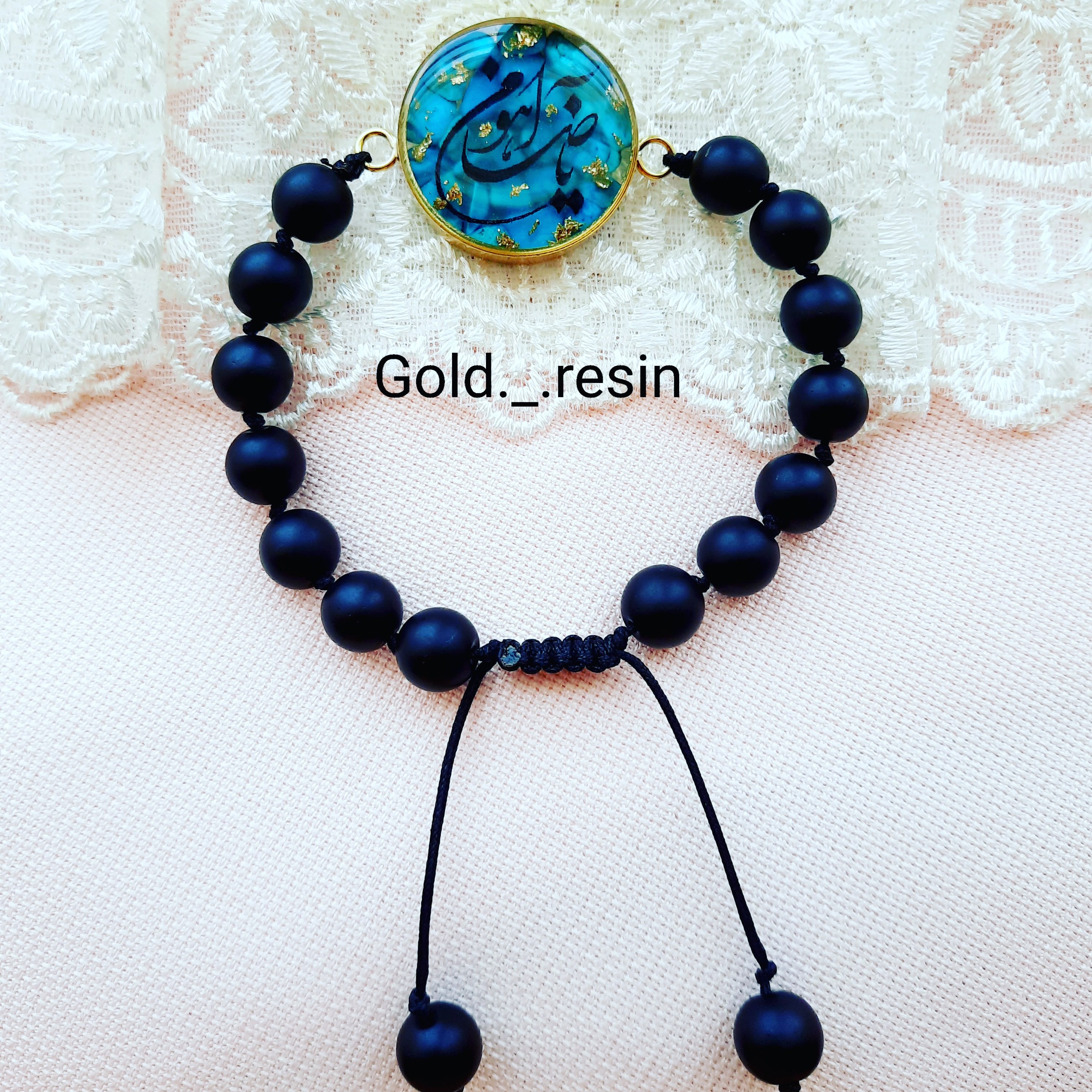 دستند رزینی با زمینه فیروزه و متن یا ضامن آهو 