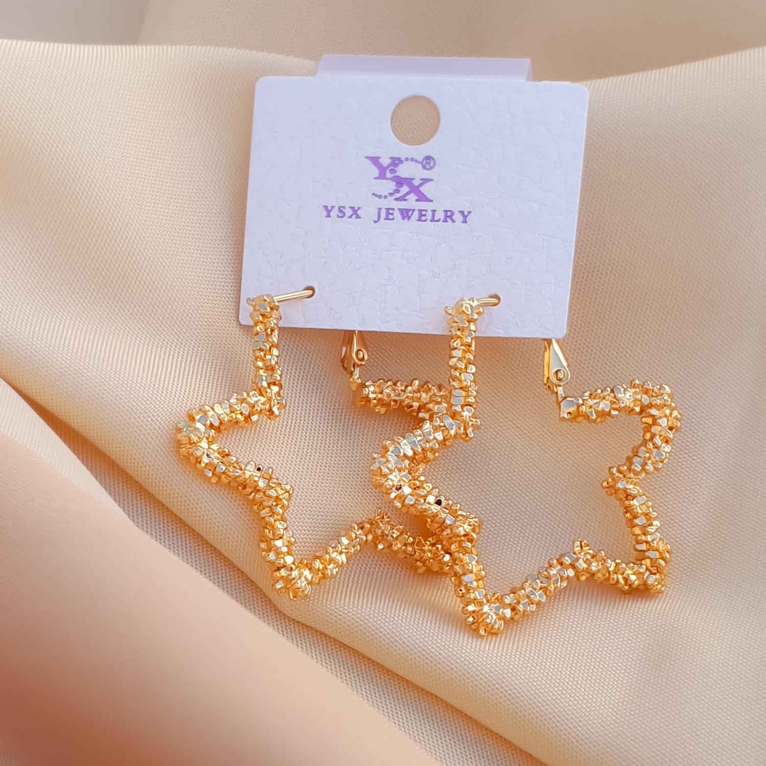 گوشواره خاویاری ،فرم ستاره ای ،رنگ ثابت و استیل ،از برندYSX