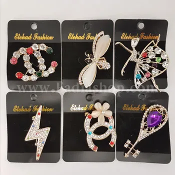 گل سینه نگین دار طلایی کد 32