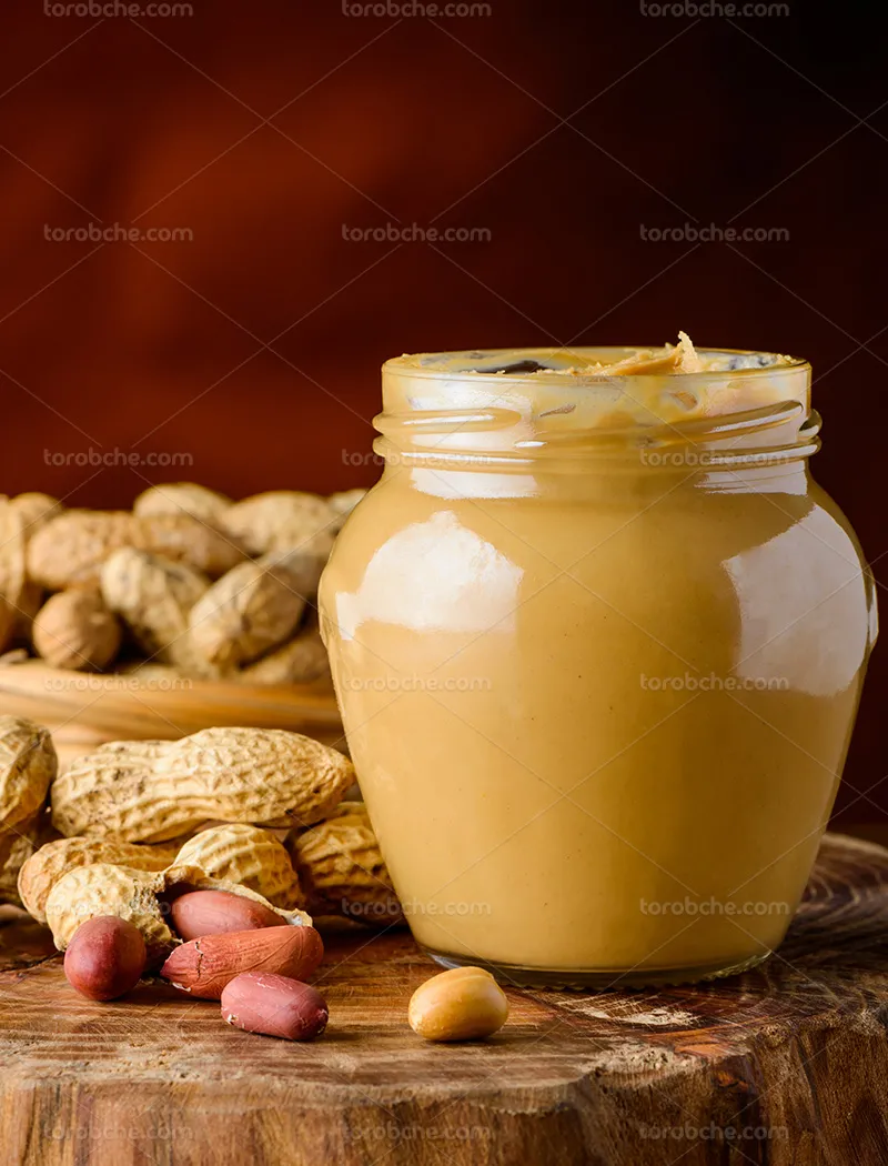 عکس شیشه کره بادام زمینی | گرافیک با طعم تربچه