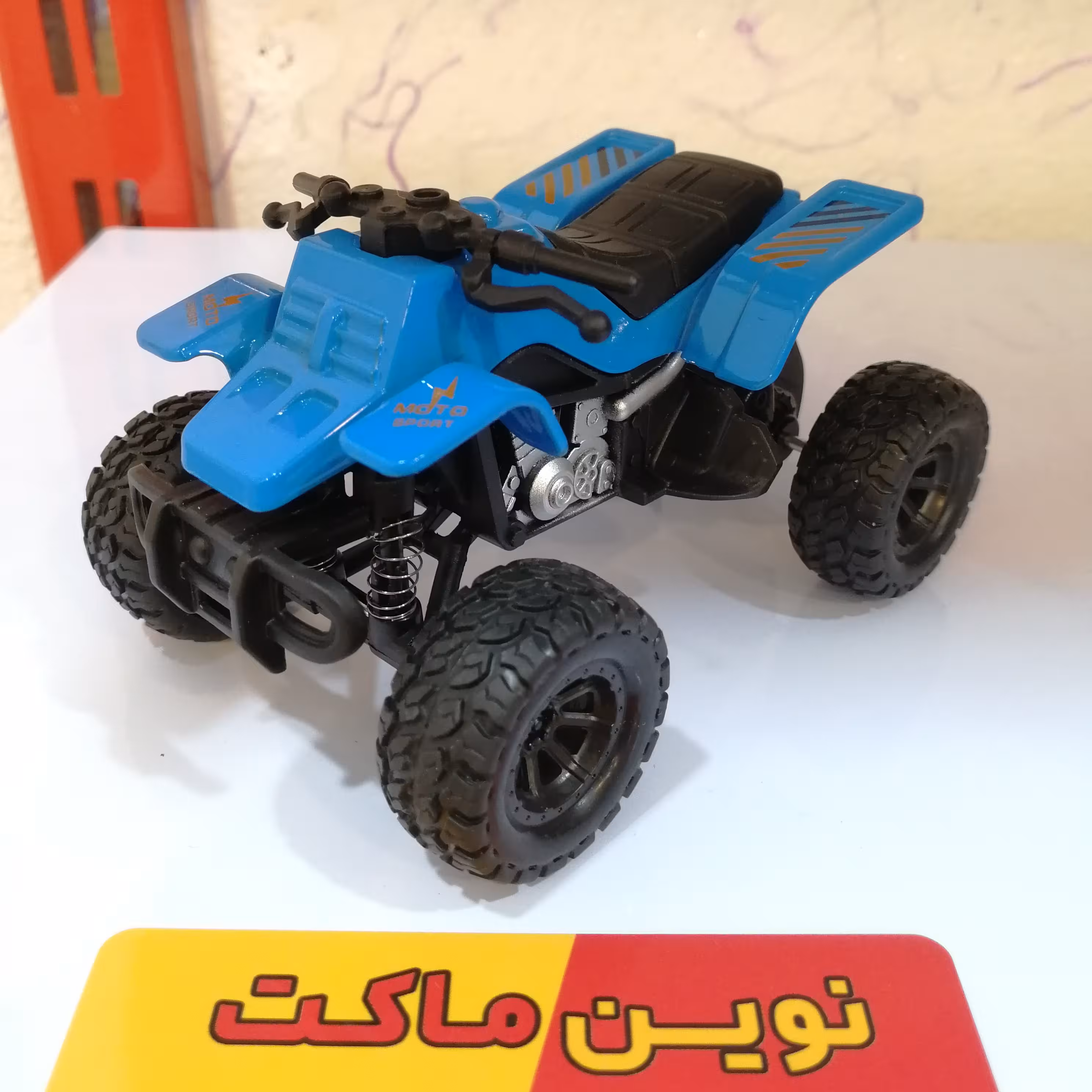 ماکت موتور اسباب بازی چهار چرخ رنگ آبی طول حدود 10 سانتی متر بصورت عقبکش