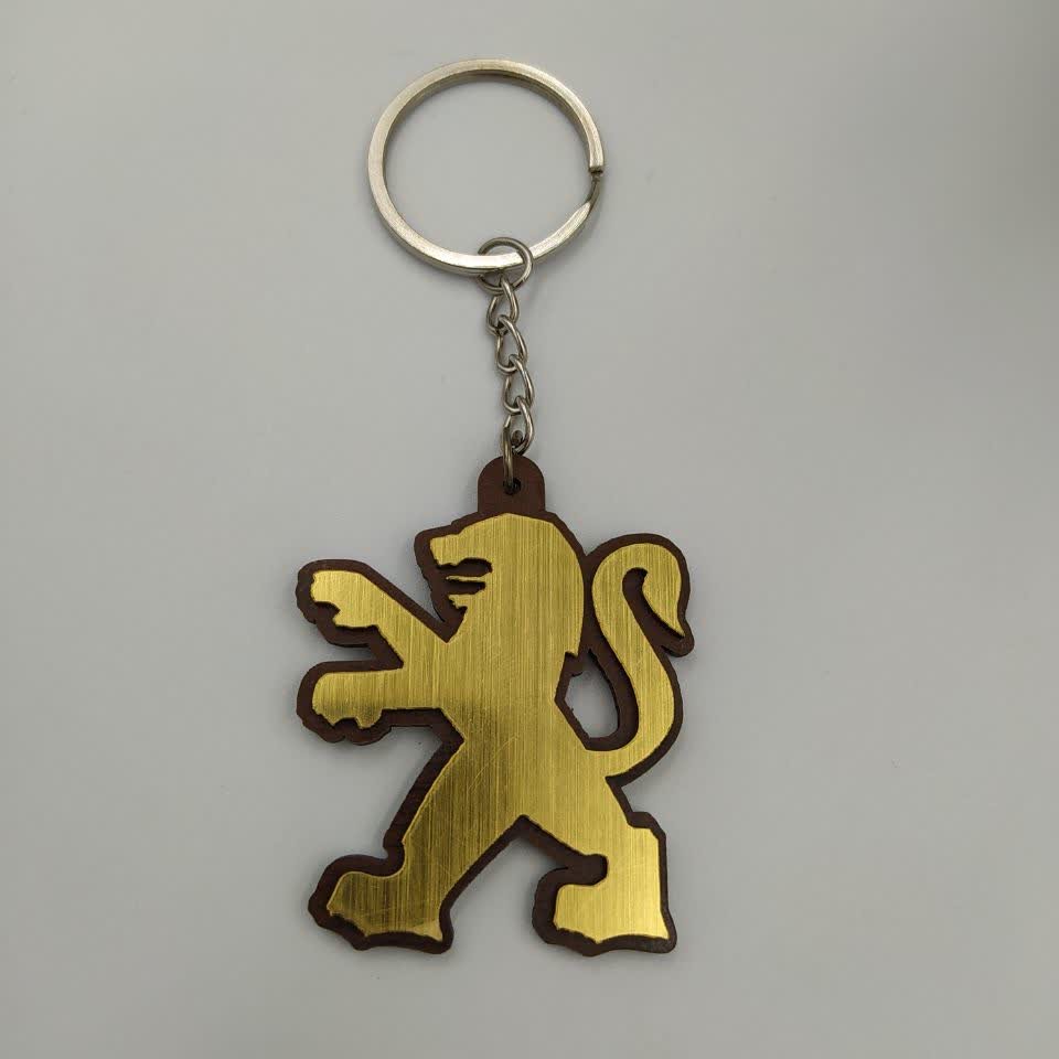 جاسوئیچی مدل خودروی پژو رنگ طلایی 