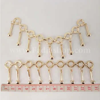 آویز لباس نگین دار طلایی