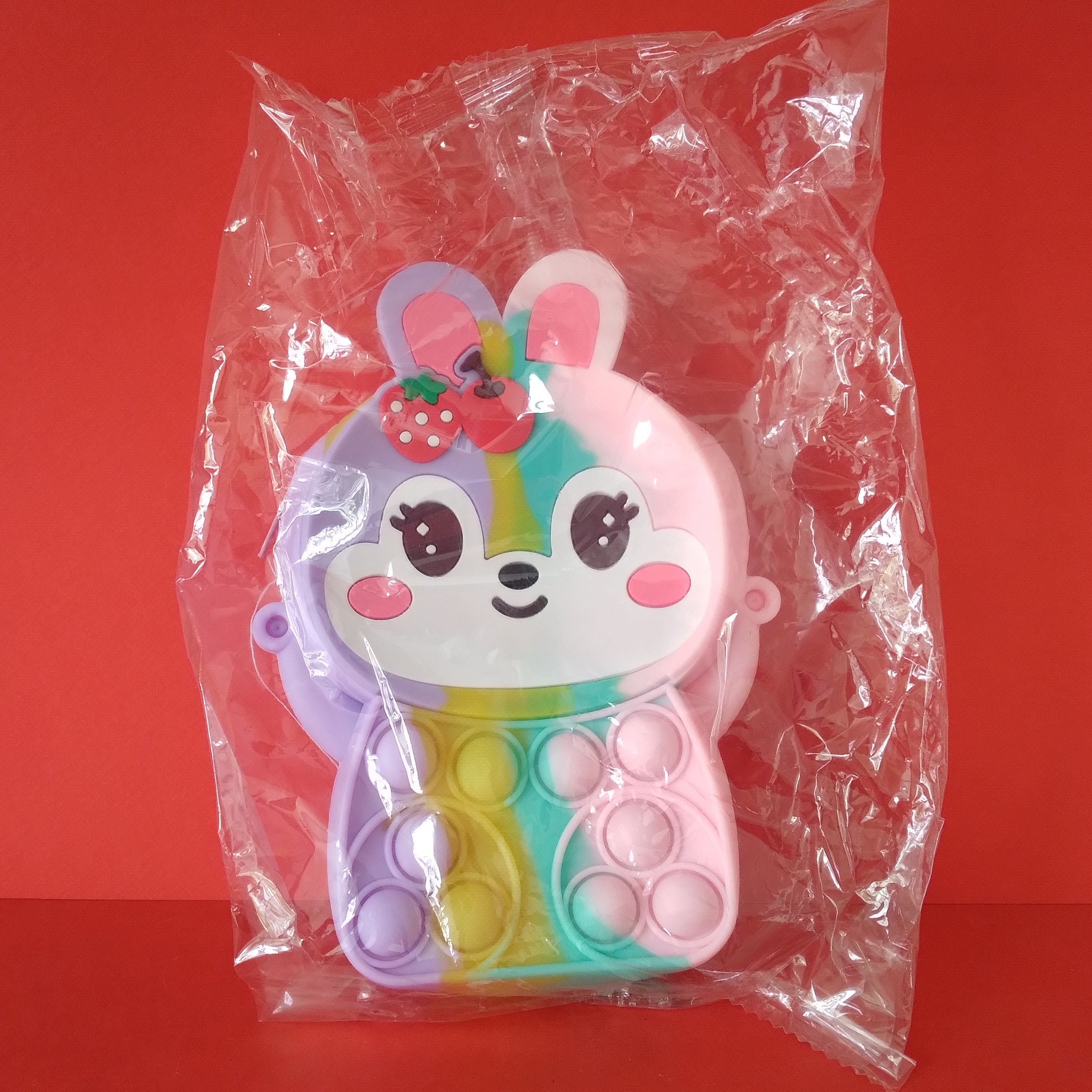 کیف سیلیکونی تک زیپ همراه با بند آویز طرح بستنی