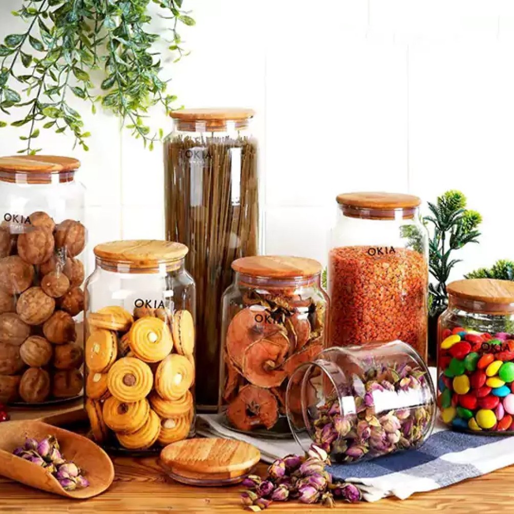 بانکه 7 سایز شیشه ای درب چوبی واشر دار مارک اوکیا مناسب انواع حبوبات و ادویه جات وماکارانی وقند وشکروشکلات و نبات و