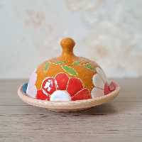 کره خوری میناکاری سفال پخت شده در کوره با رنگ ثابت و کاملا مصرفی رنگ زمینه پرتقالی