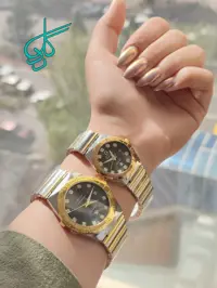 خرید ست ساعت زنانه و مردانه فلزی طرح OMEGA تقویم دار رنگ ثابت دارای قفل ضامن دار با کیفیت دارای رنگبندی کد 2116630 - ردگل