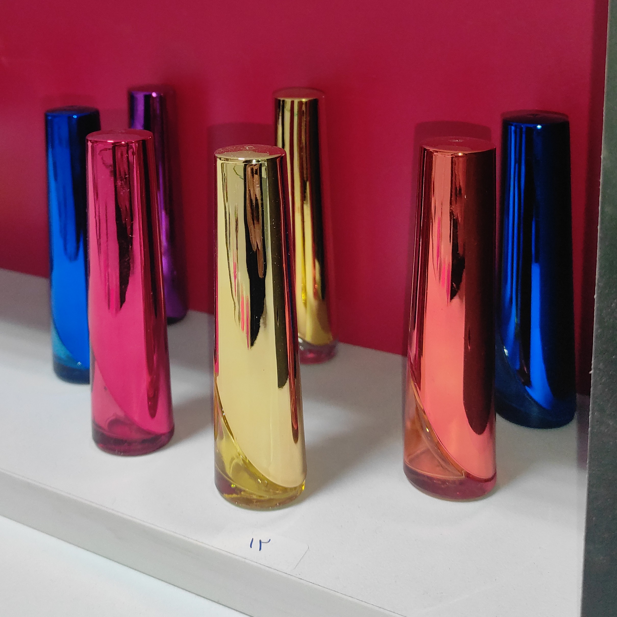 شیشه عطر و ادکلن  مدل شمعی 12میل در  رنگ های مشکی.ابی زرد طلایی بنفش قرمز و نارنجی 