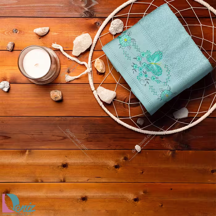 حوله دستی گلدوزی طرح پروانه رنگ فیروزه ای