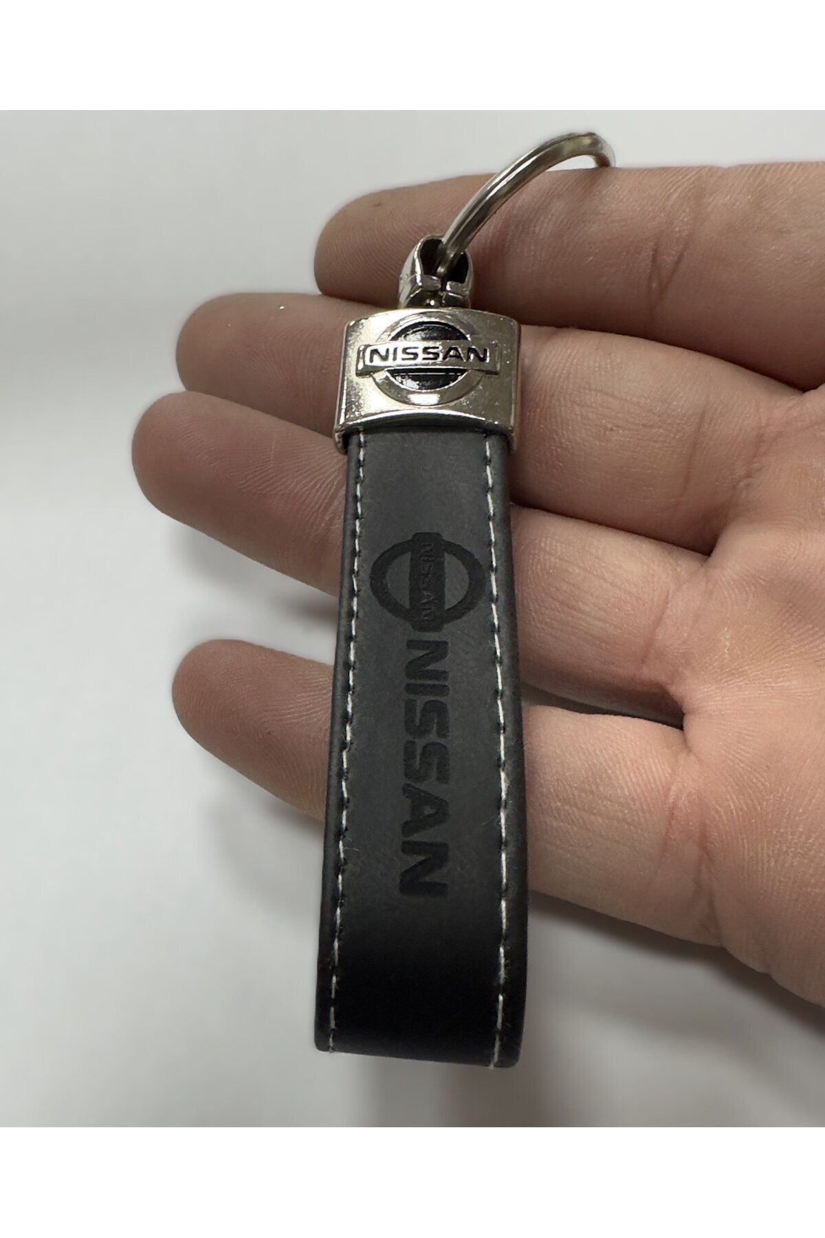 جاسوئیچی خودرو مشکی چرم ترمو نیسان و آرم سیاه imza direksiyon Genel Markalar