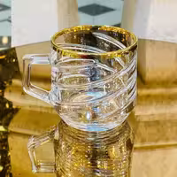 فنجان لب طلایی خط خطی مارک بلینمکس ساخت چین (پس کرایه)