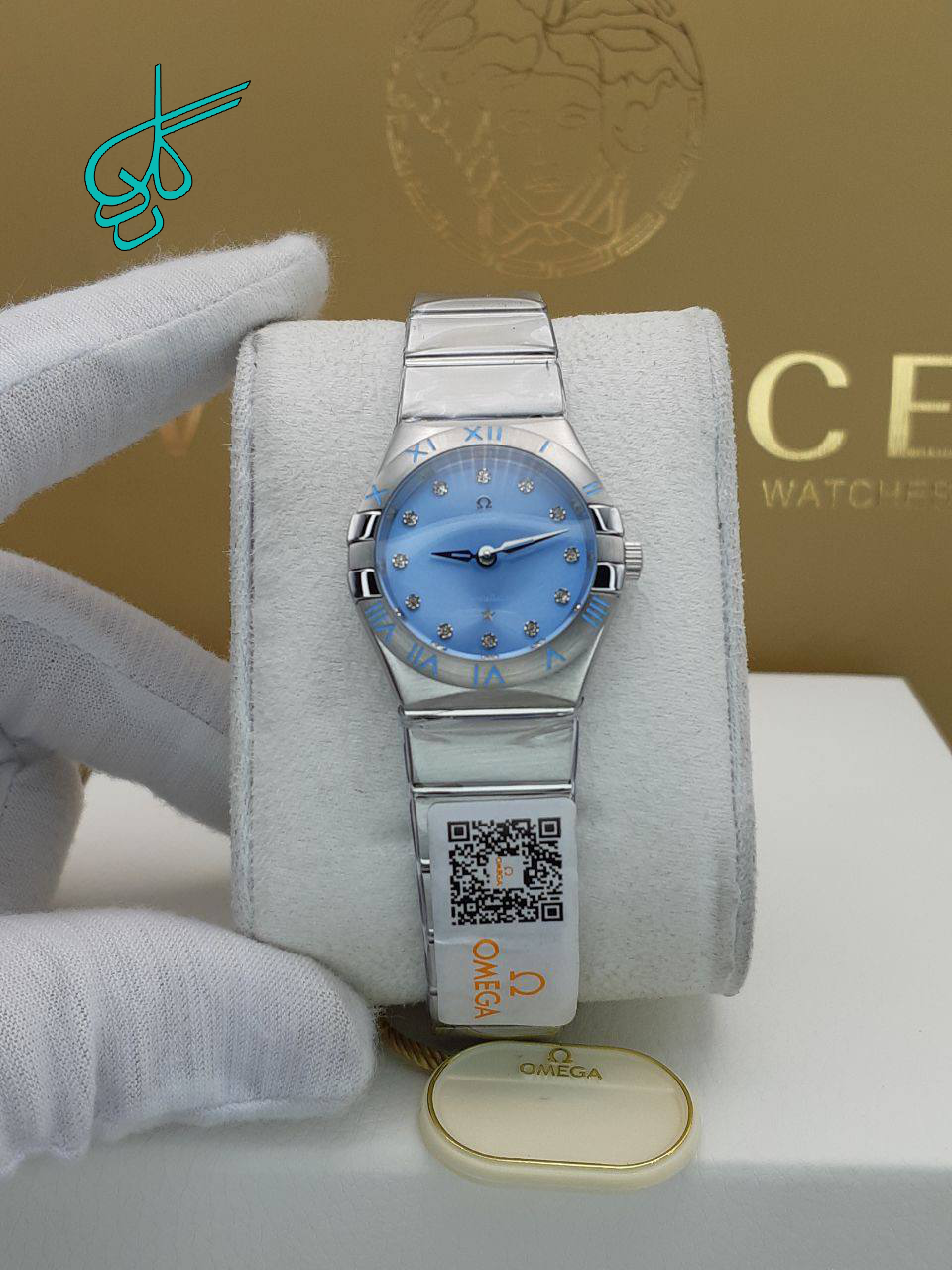 خرید ساعت زنانه امگا موتور ژاپن کوراتز جنس استیل رنگ ثابت و ضد حساسیت شیشه کریستال سافایر معدنی ضدخش سایز قاب 31 میلیمتر ضدآب ایندکس نگین دار کد 1918143 - ردگل